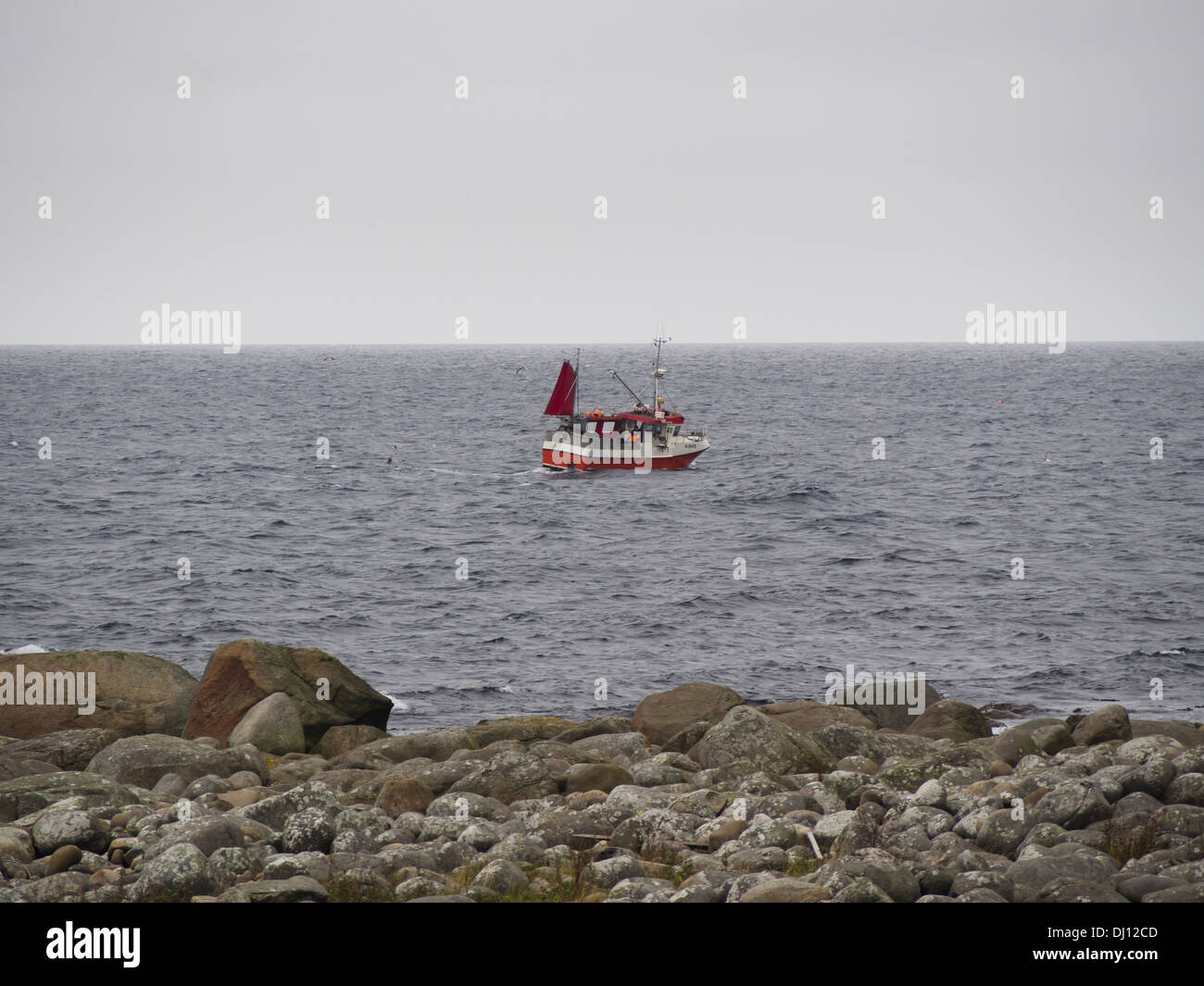 Fishing boat off the Coast of western Norway , Jæren near Stavanger, North Sea fishing  in wind and rain Stock Photo