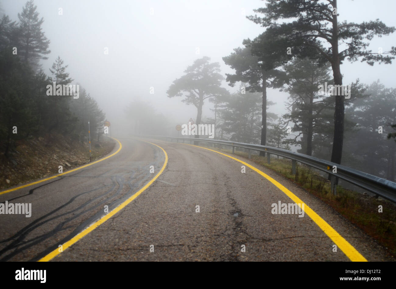 Fog covers the road to Guadarrama mountain range, Madrid Stock Photo