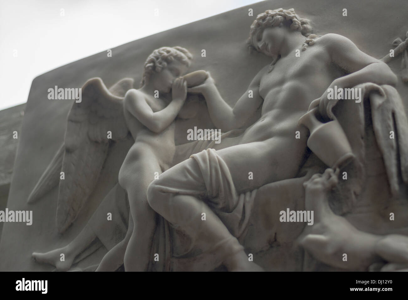 Marble tablet depicting an angelic figure, man and dog Stock Photo