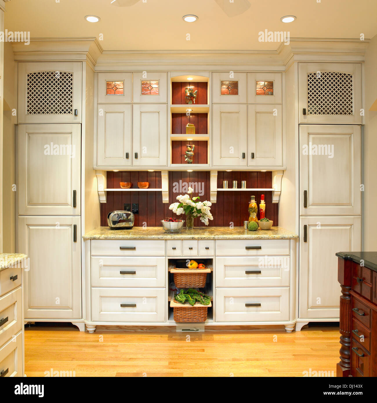 Traditional Built In Kitchen Cabinetry With Cream Finish And Dark