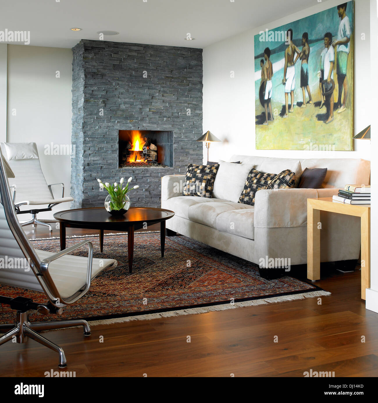 Living Room With Stone Fireplace And Modern Furniture Stock Photo - Alamy