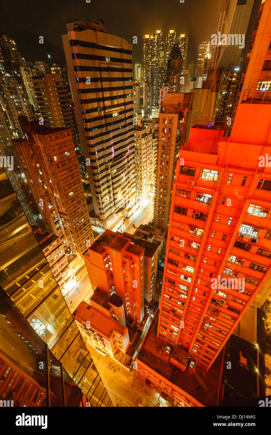 Vertical aerial view of downtown skyscrapers in Hong Kong illuminated ...