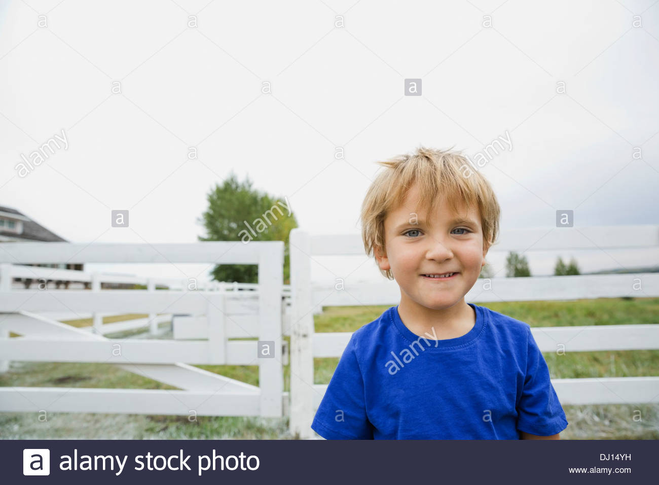 Portrait of smiling boy standing outdoors Stock Photo