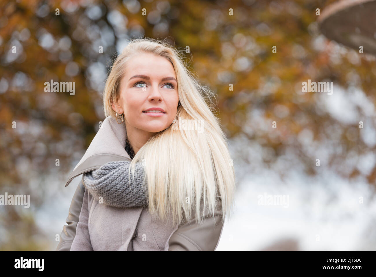 Beautiful, happy young woman with blonde hair relaxing in a park Stock ...