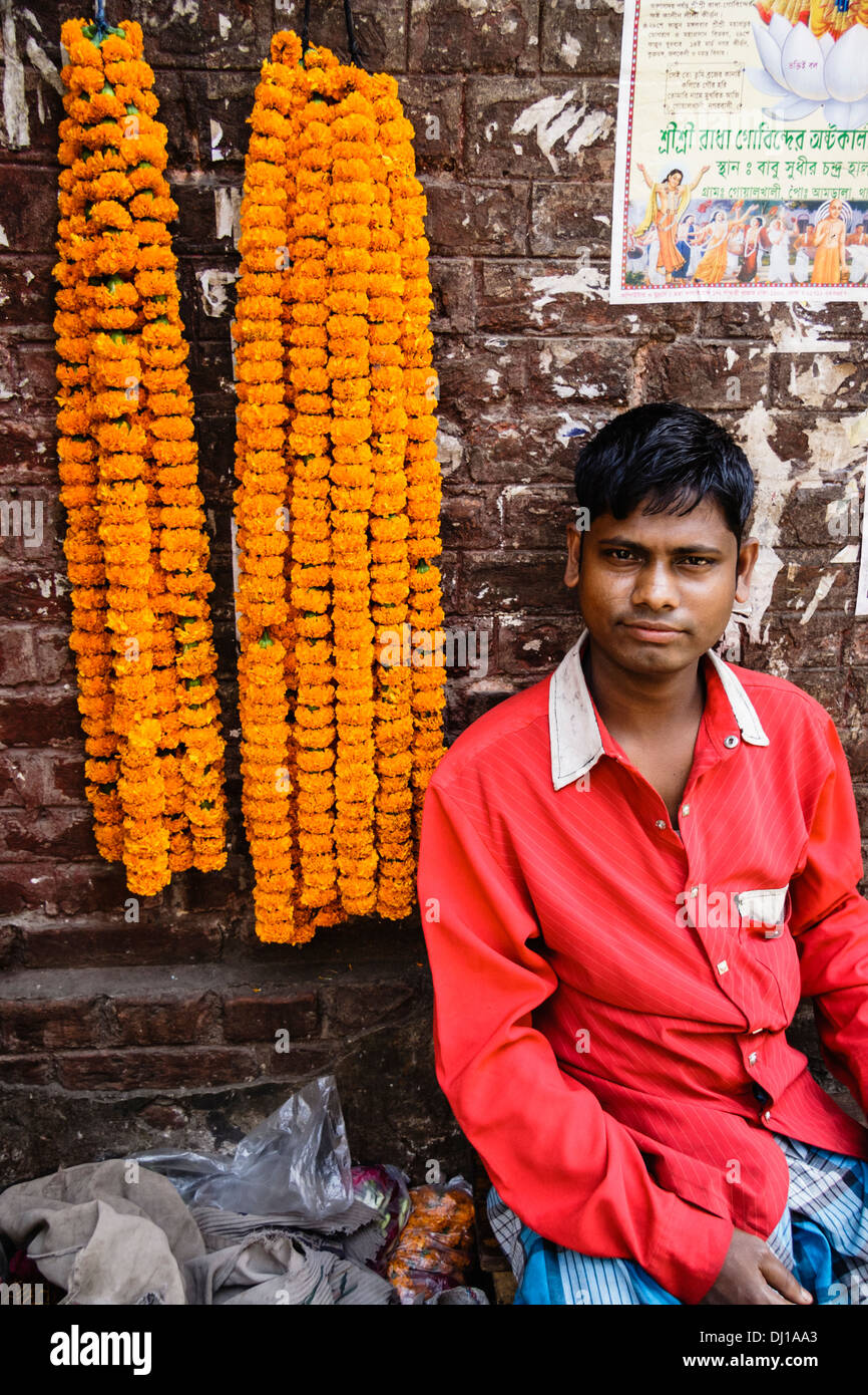 Marigold garlands seller at Shankharia Bazaar, Old Dhaka, Bangladesh Stock Photo