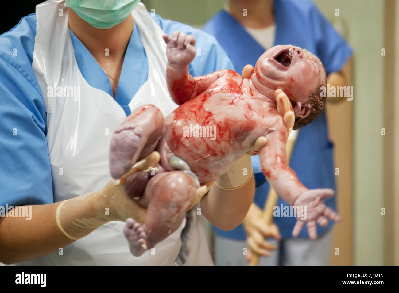 New born baby in doctor's hands Stock Photo