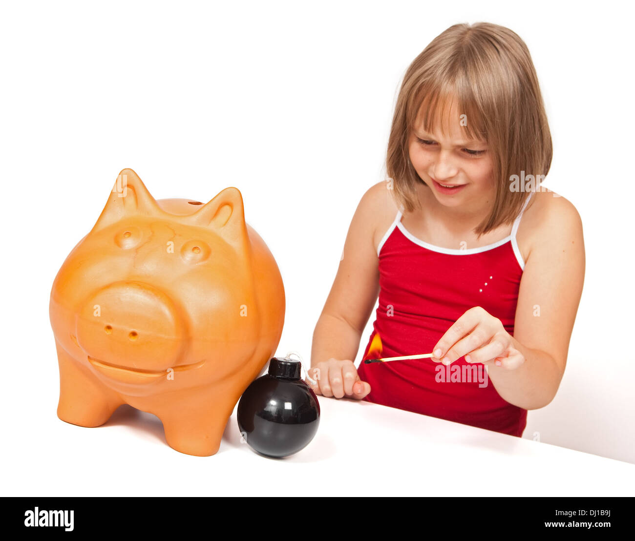 Girl preparing to explode piggy bank with bomb Stock Photo