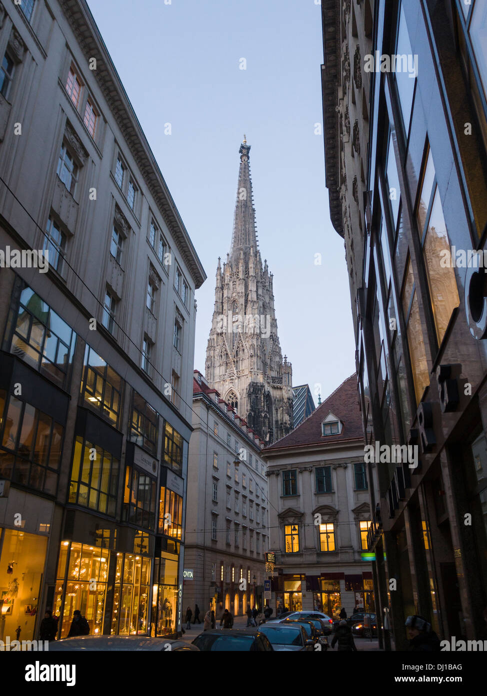 Steffi the huge tower of the Cathedral glows at dusk above the downtown stores. Stock Photo