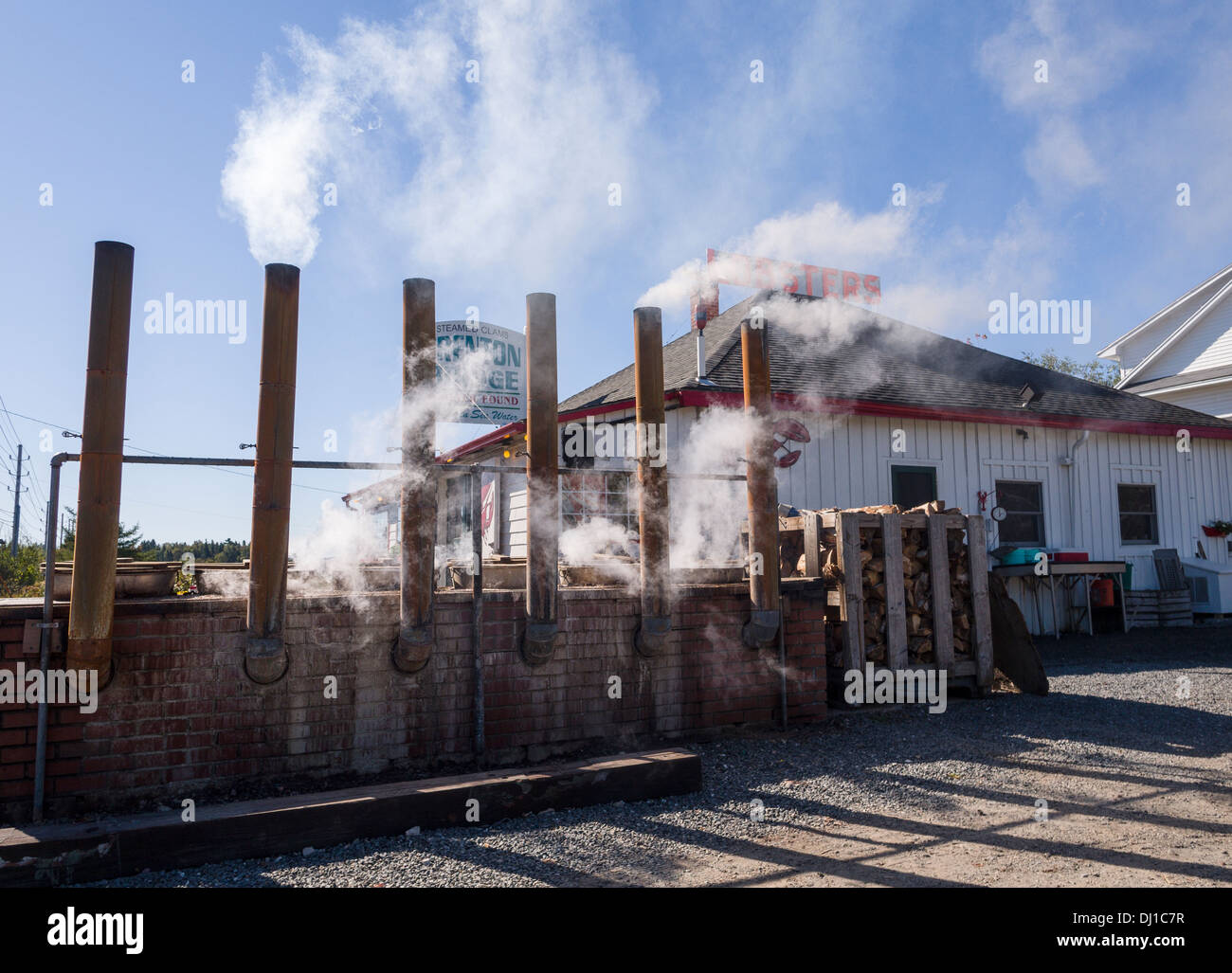 Lobster Pound Outdoor cooking pots. Smoke and steam rise from a row of wood fired lobster cooking pots outside Trenton Bridge Stock Photo