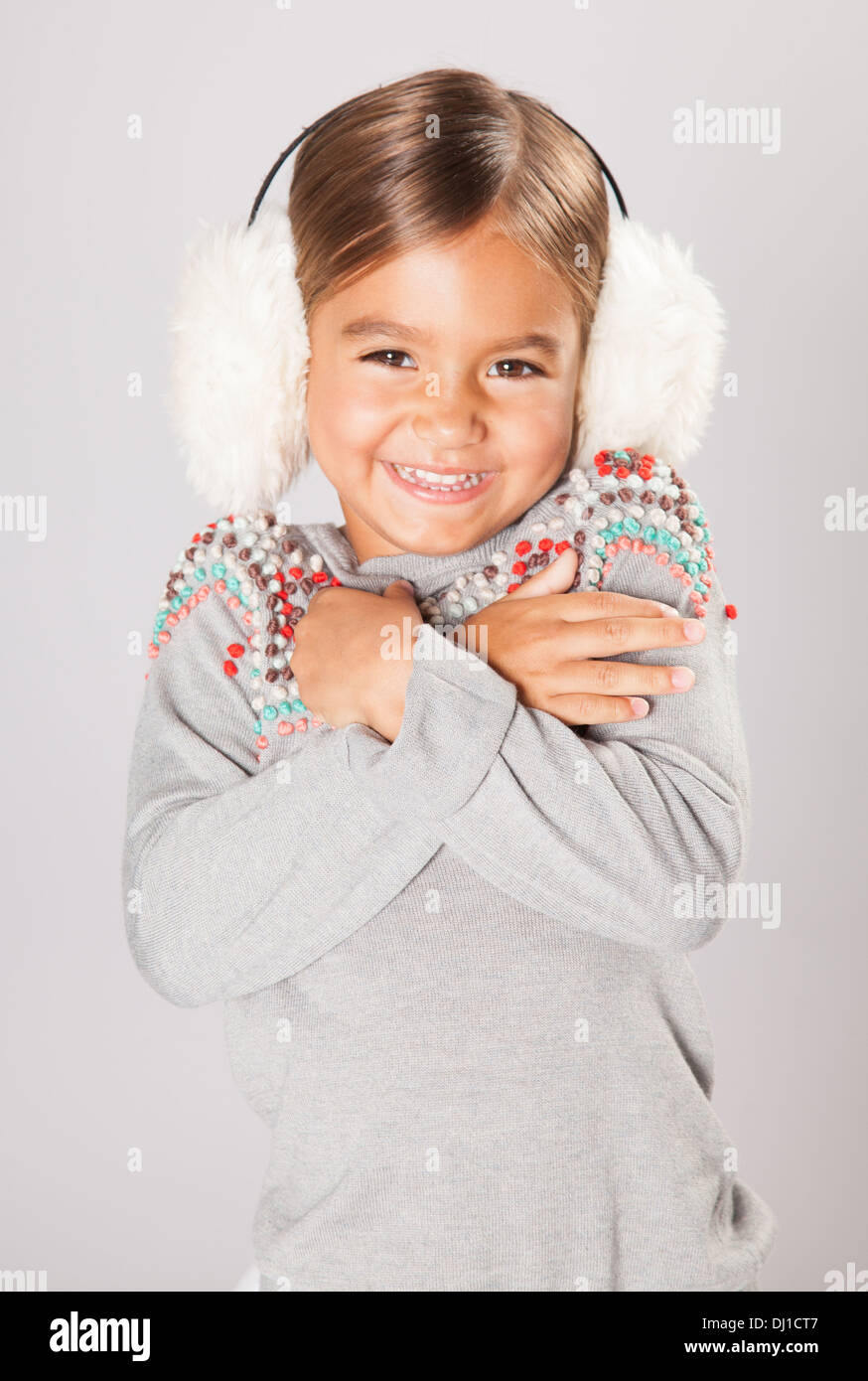 Little girl wears ear muffs Stock Photo Alamy