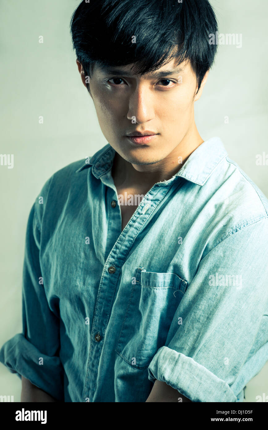 Studio fashion pose by a handsome young male model, with fashion tone ...