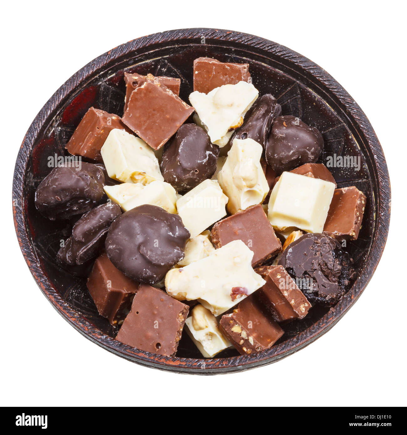 top view of bowl with chocolate candies and broken bars isolated on white background Stock Photo
