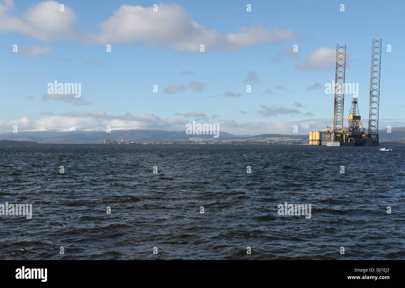 Oil rig in Cromarty Firth with Ben Wyvis Scotland  November 2013 Stock Photo