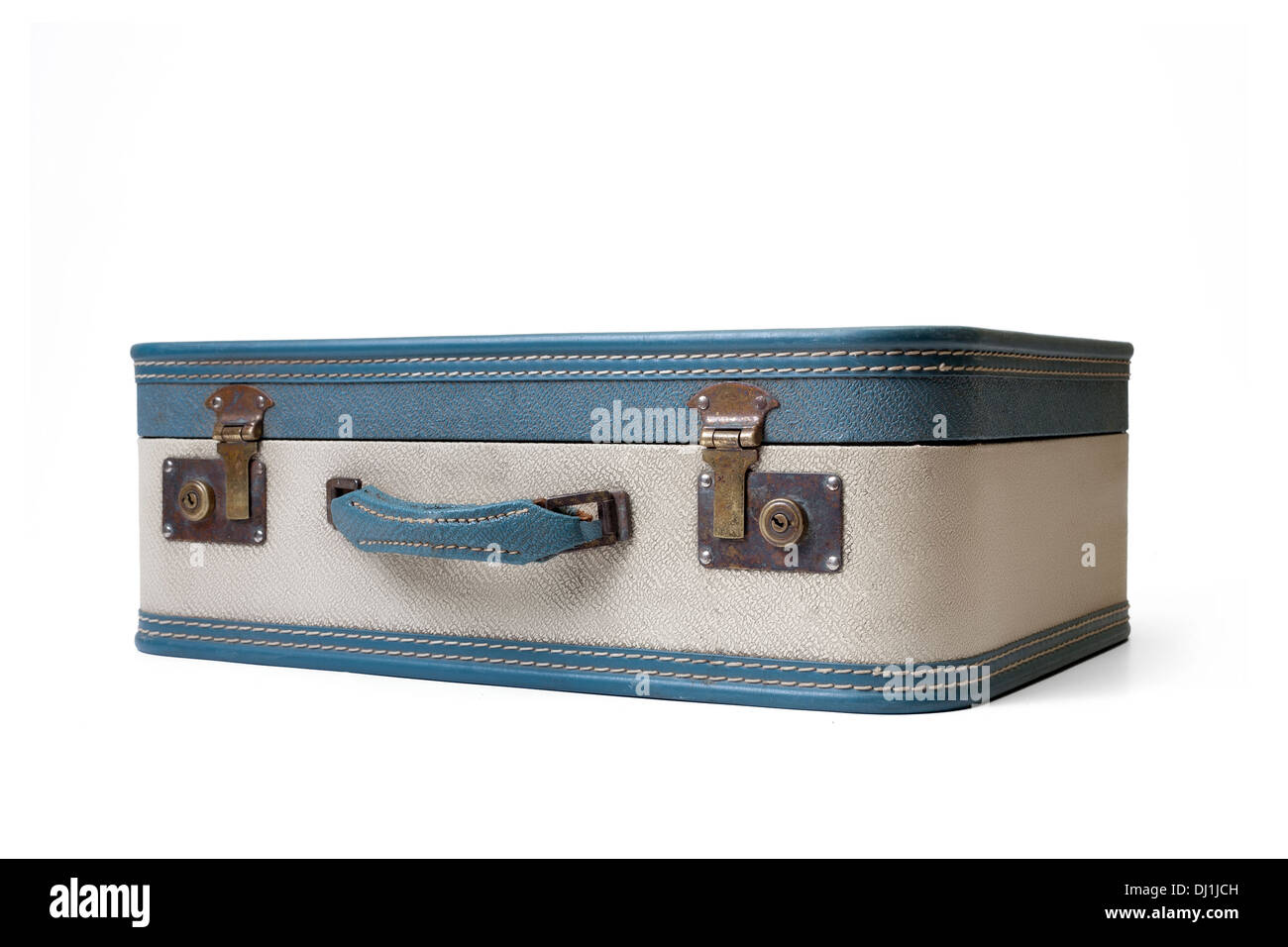 Retro traveled suitcase isolated on white. Stock Photo