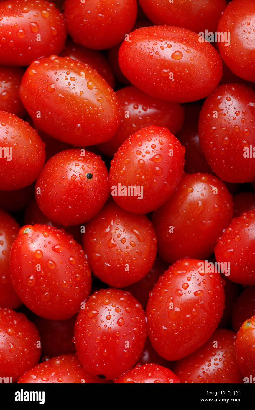 Cherry tomatoes background Stock Photo - Alamy