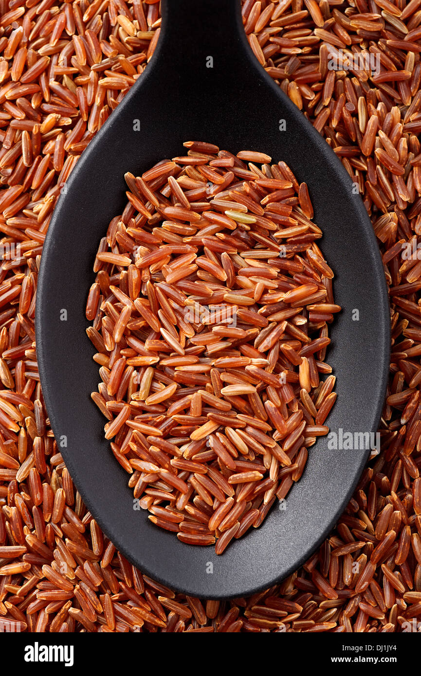 Spoon raw red rice hi-res stock photography and images - Alamy