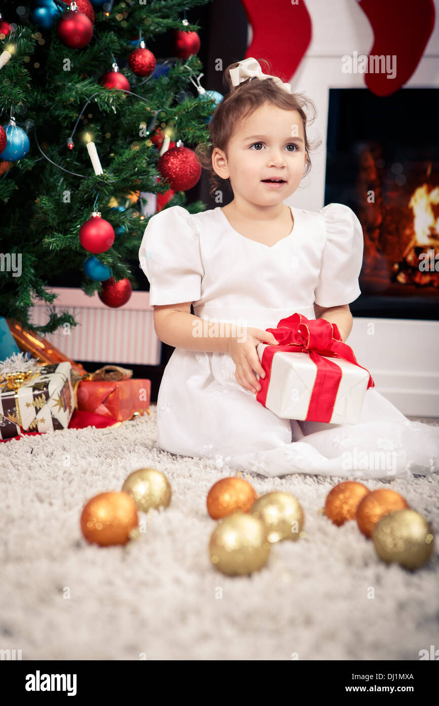 a little girl with Christmas Tree decoration Stock Photo