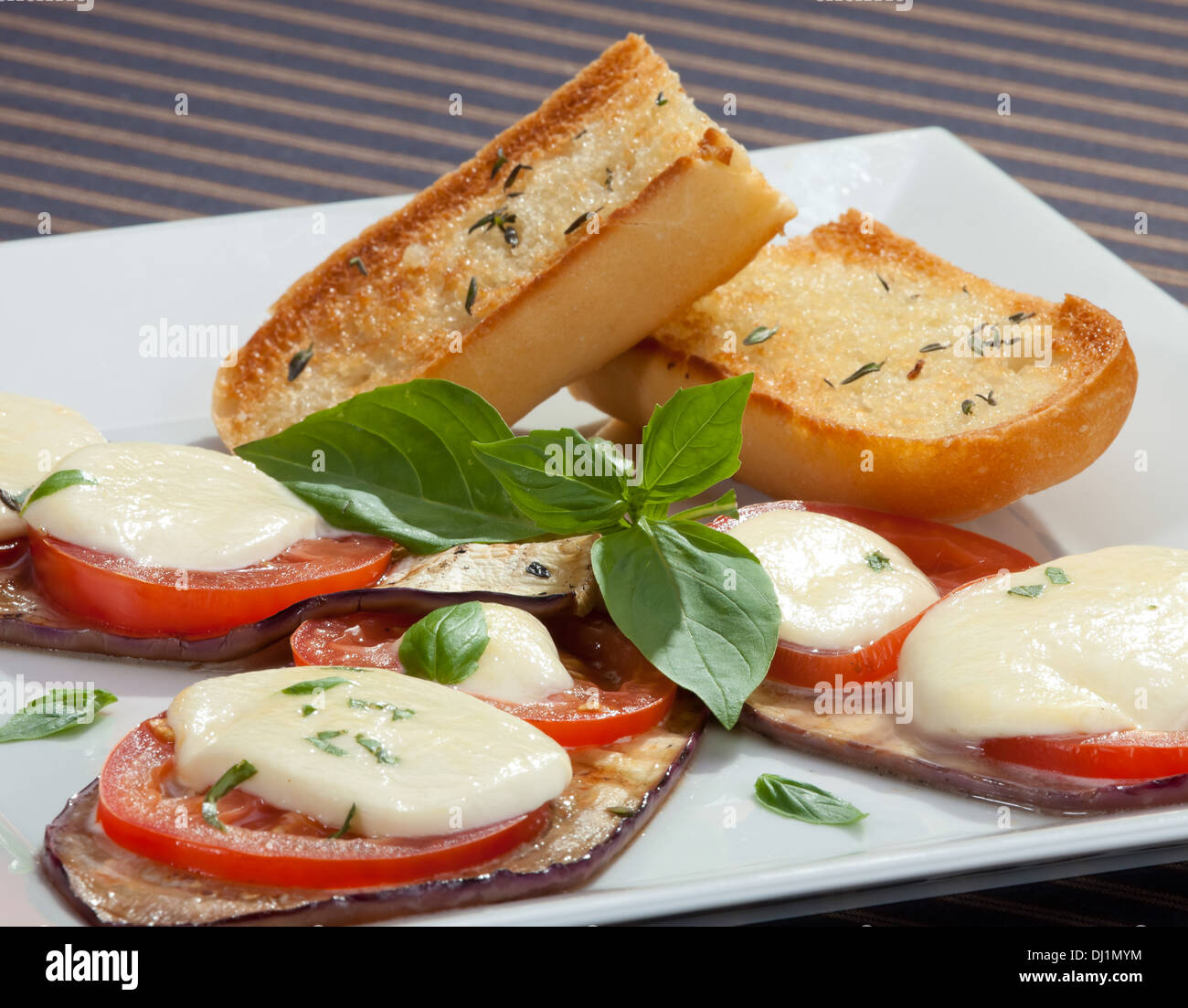 Baked aubergine w tomatoes and mozzarella Stock Photo Alamy