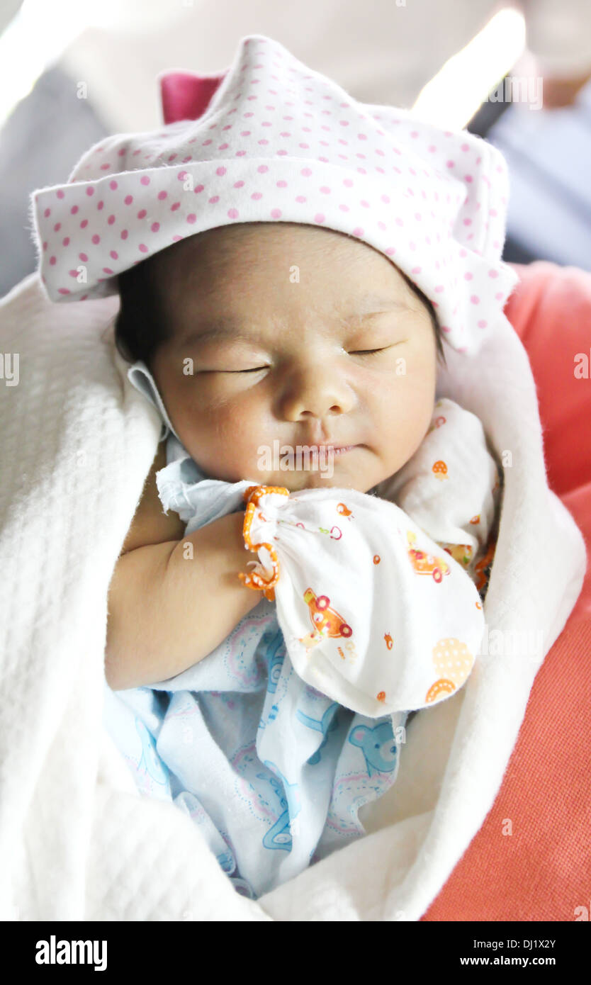 Newborn Asian baby girl sleeping Stock Photo