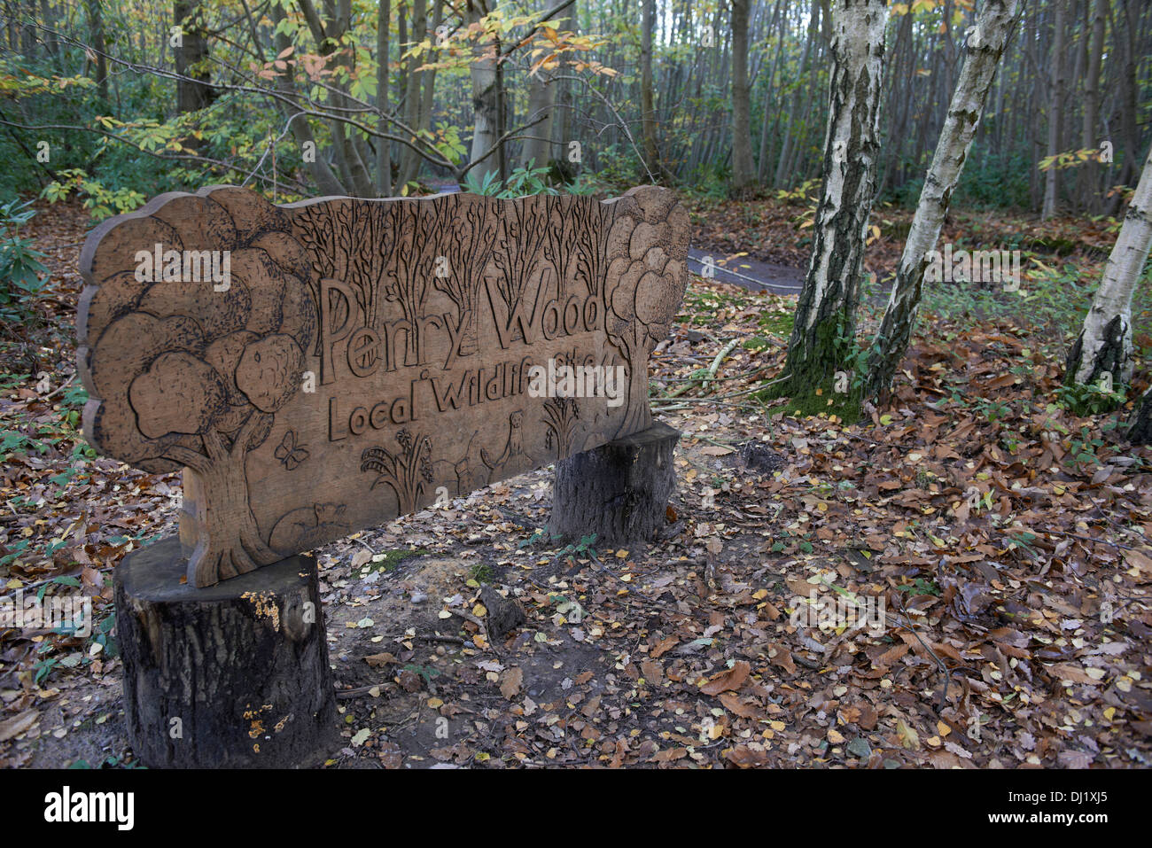 Carved wooden sign for Perry Wood in Kent England Stock Photo