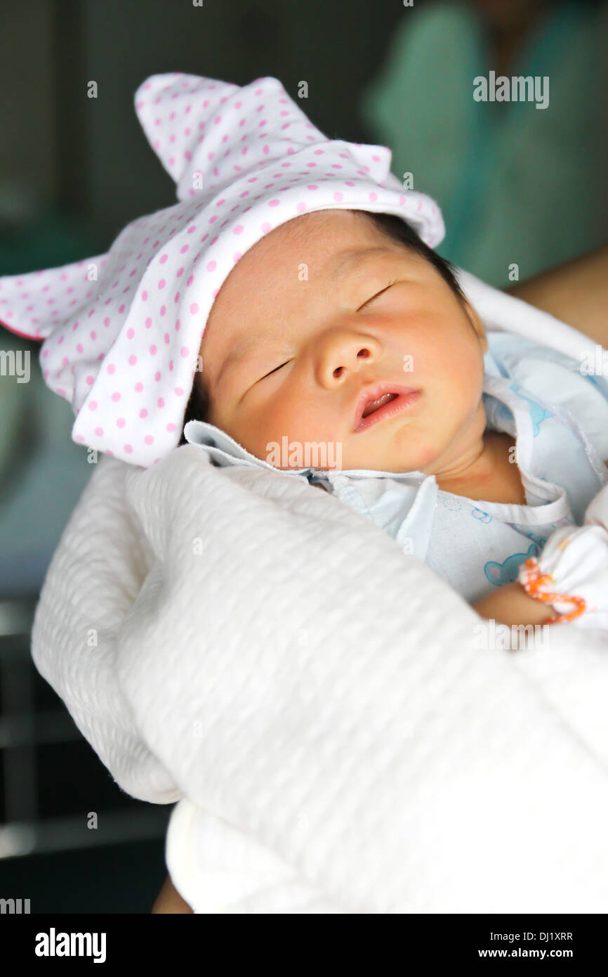 Newborn Asian baby girl sleeping Stock Photo - Alamy