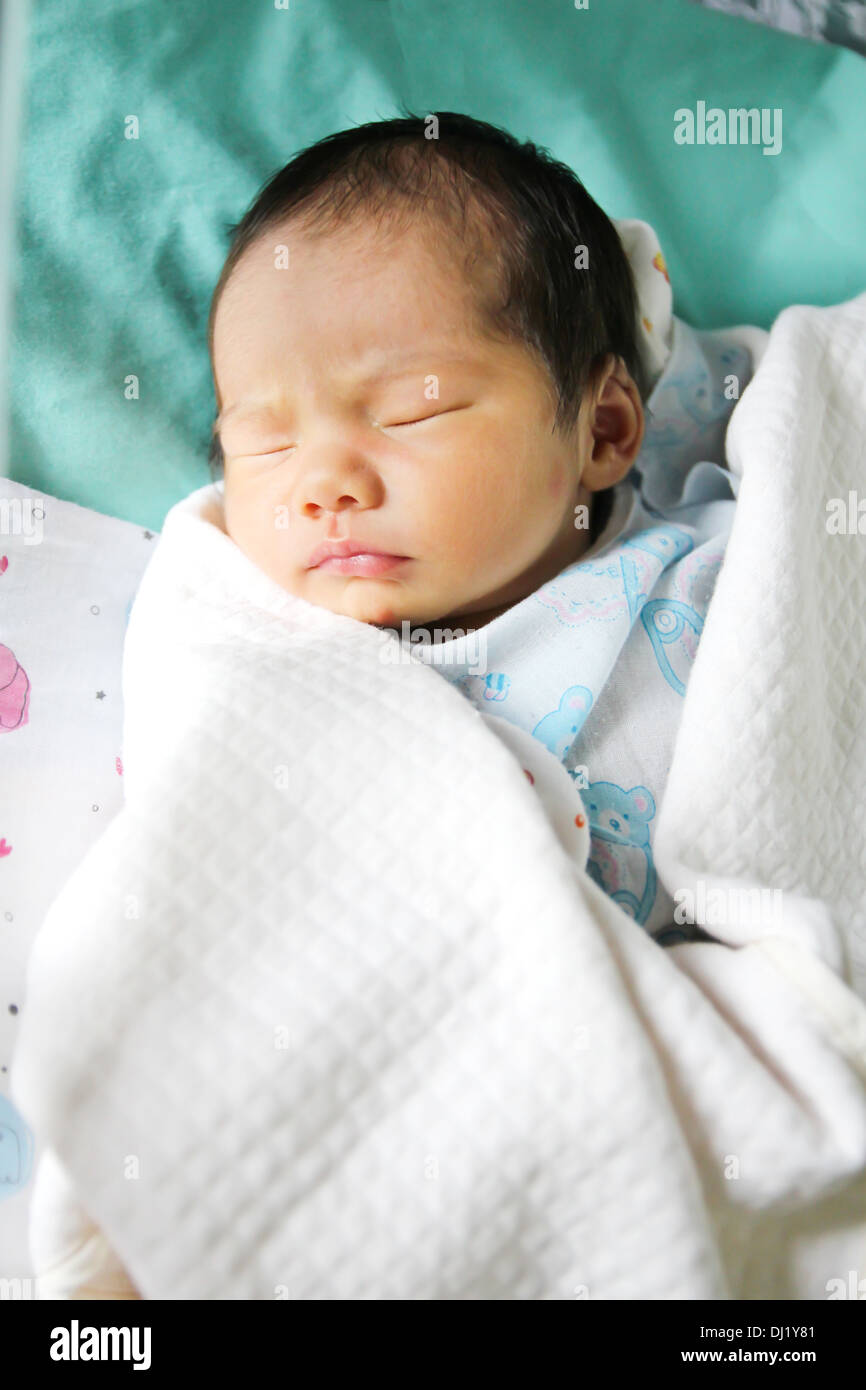 Newborn asian baby girl in hospital Stock Photo