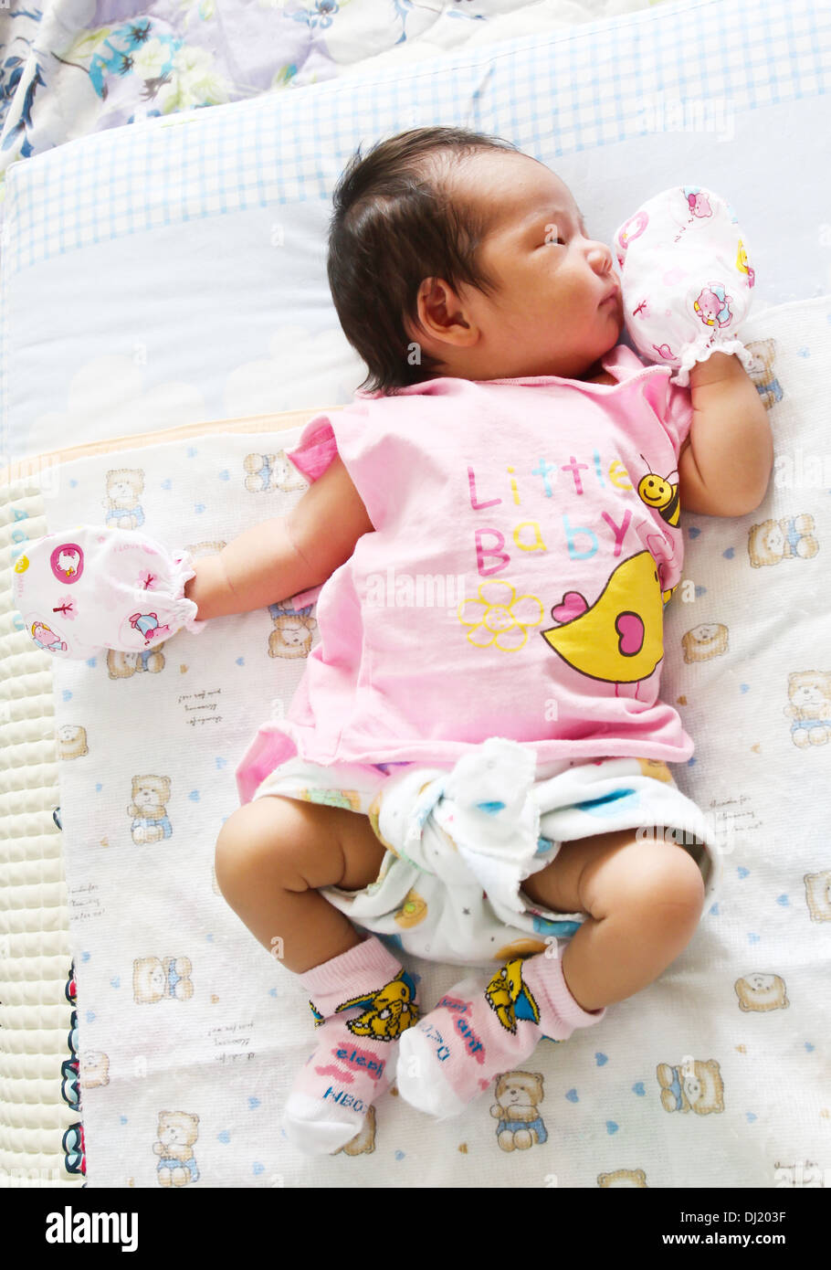 Newborn Asian baby girl sleeping Stock Photo
