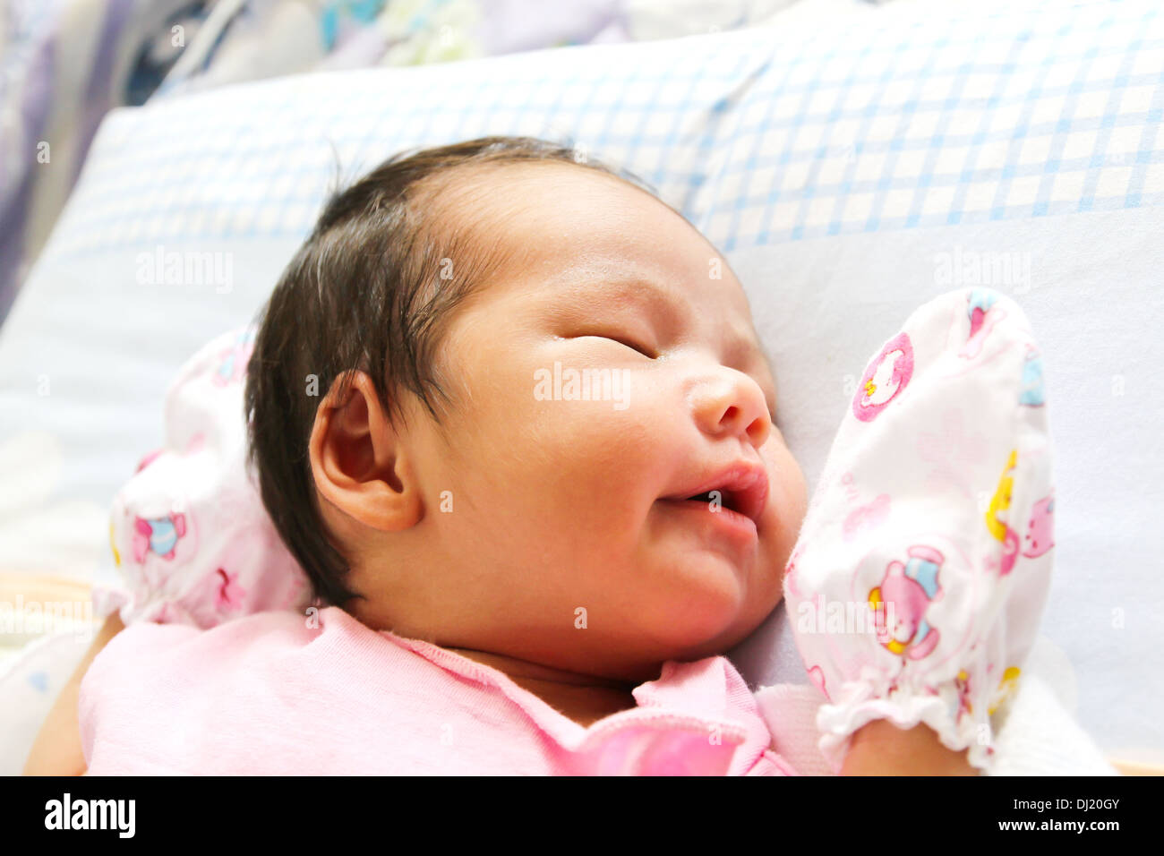 Newborn Asian baby girl sleeping Stock Photo