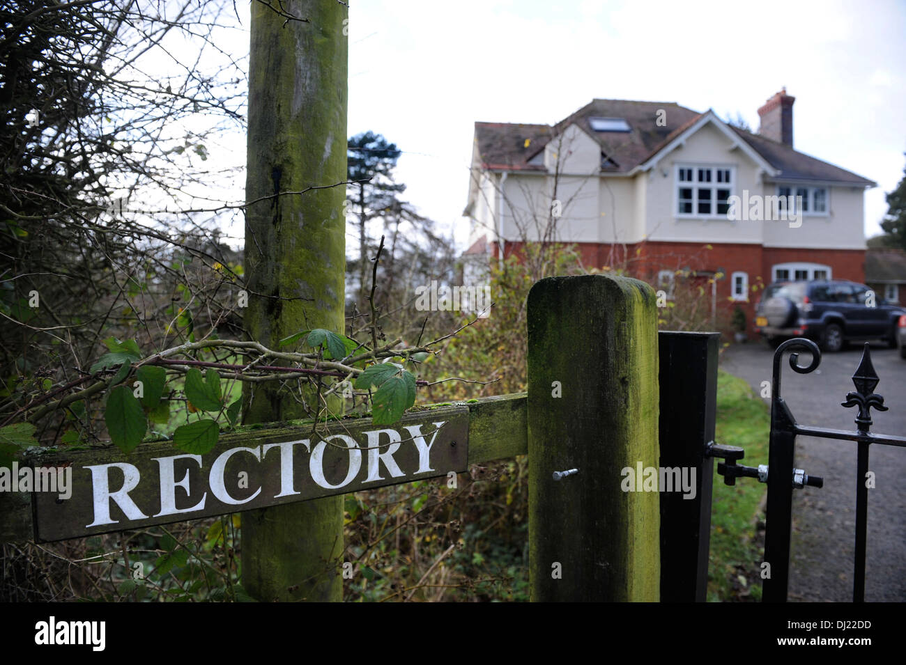An unkempt sign to a modern Rectory UK Stock Photo