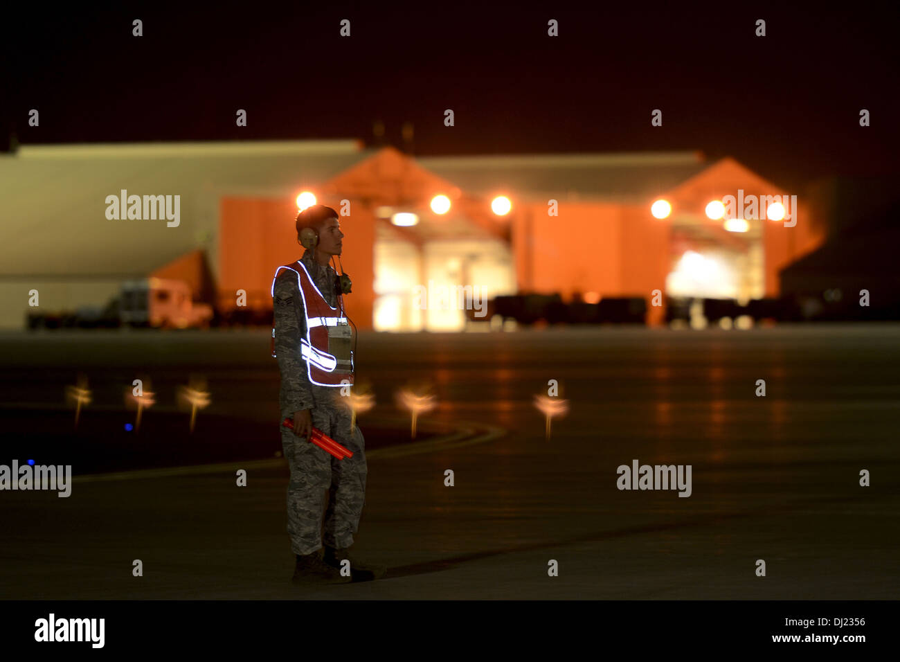 U.S. Air Force Senior Airman Donald Rhodes, a weapons loader with the 169th Aircraft Maintenance Squadron at McEntire Joint National Guard Base, South Carolina Air National Guard, waits at the end of runway at Nellis Air Force Base to launch F-16 Fighting Stock Photo