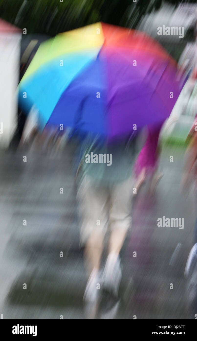 Motion Blur Rendering Of Person Walking In The Rain With A
