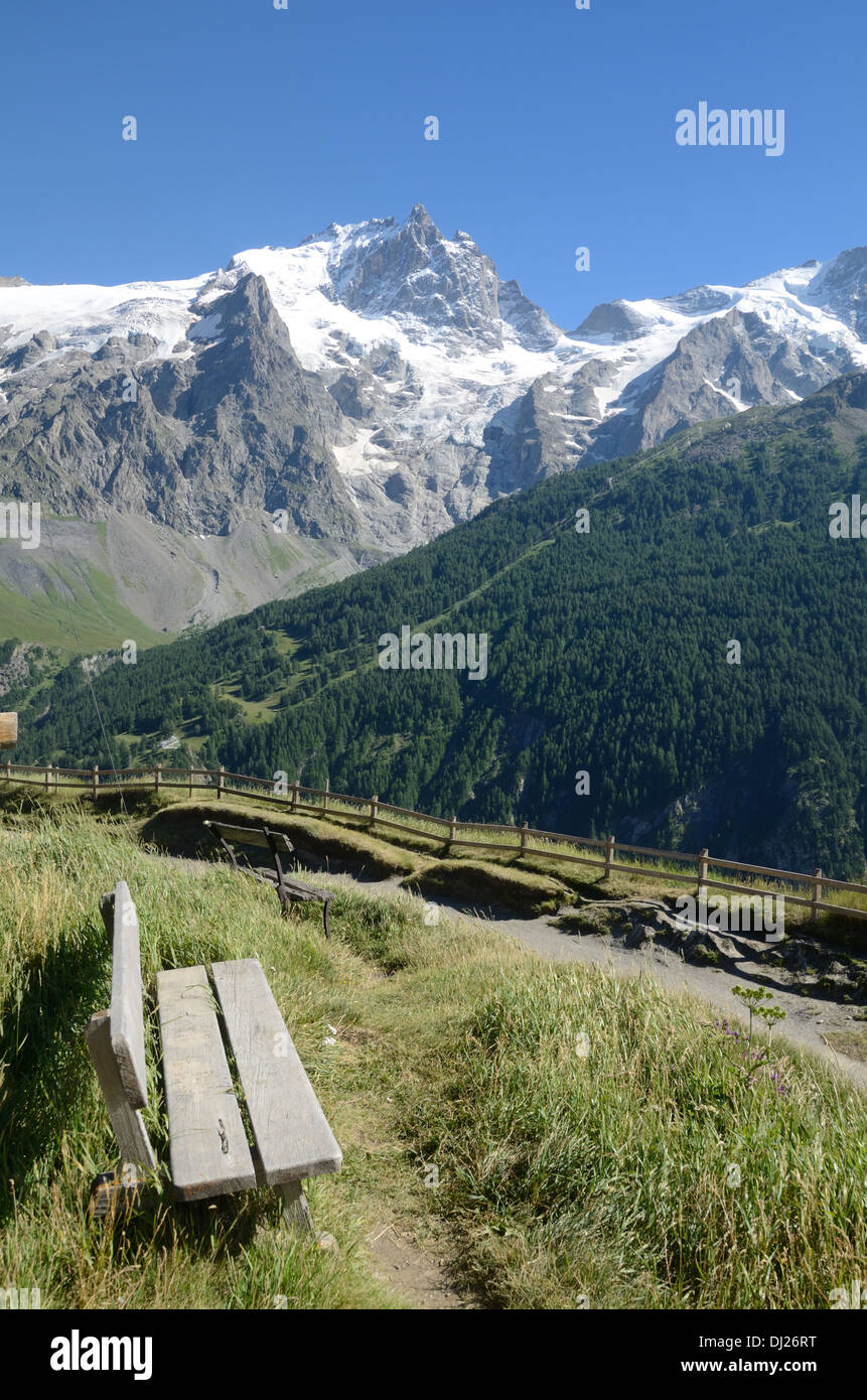 La Meije Peak from Le Chazelet La Grave & Vacant Wooden Bench with View over the Ecrins National Park French Alps Hautes-Alpes France Stock Photo
