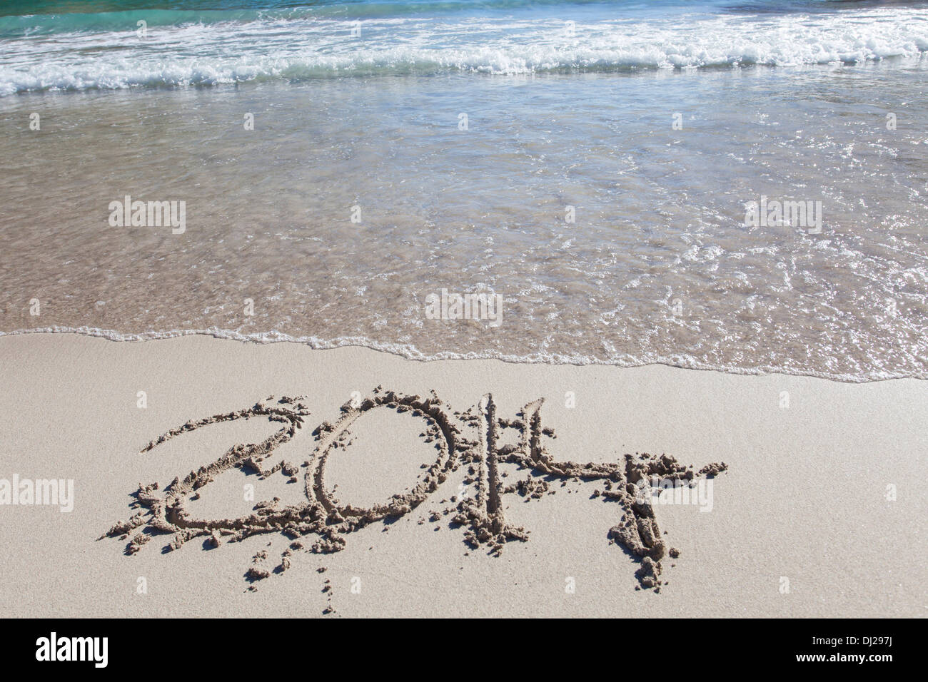 2014 written in the sand Stock Photo - Alamy