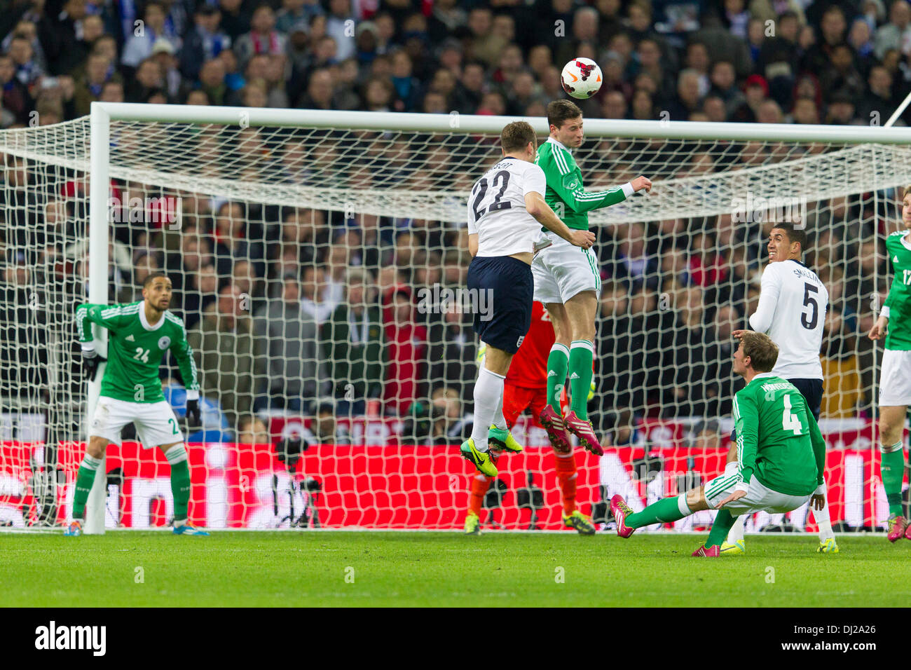 i19.11.2013 London, England. Germany's Julian DRAXLER wins a header under pressure from England's Rickie LAMBERT in his own penalty box during the International football friendly game between England and Germany from Wembley Stadium. Stock Photo