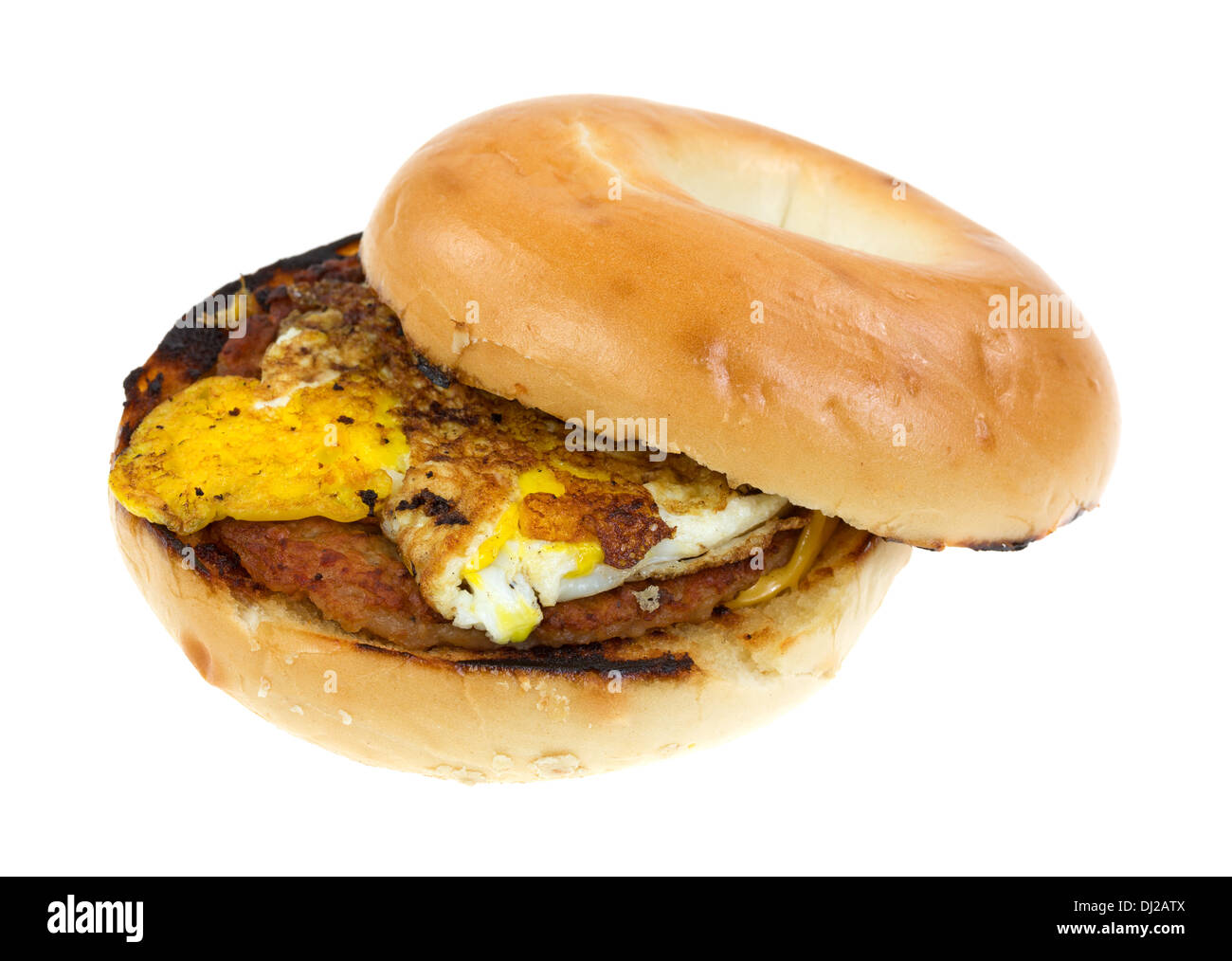A breakfast bagel with sausage egg and cheese on a white background. Stock Photo