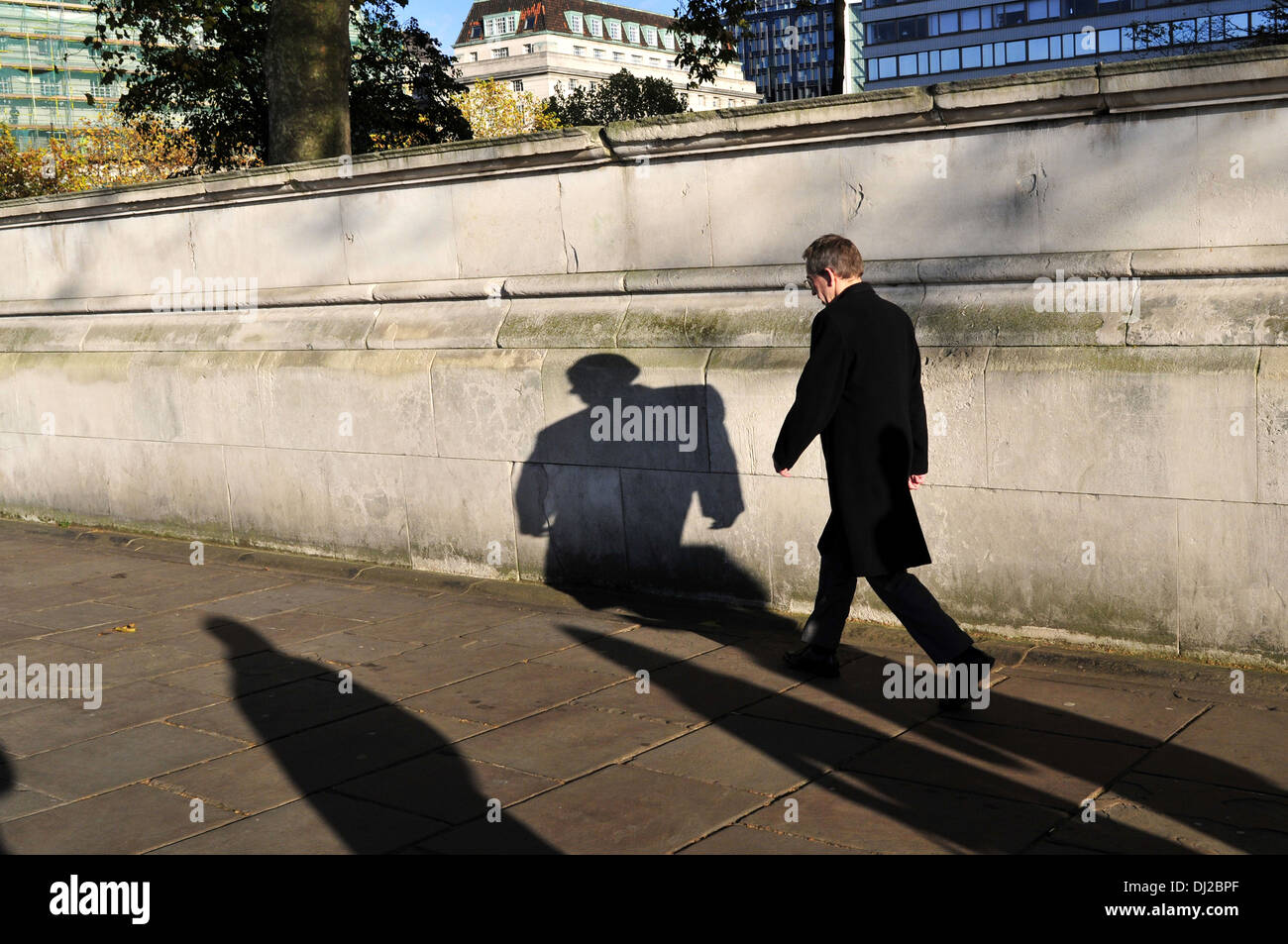 A man and his shadow, London, UK Stock Photo