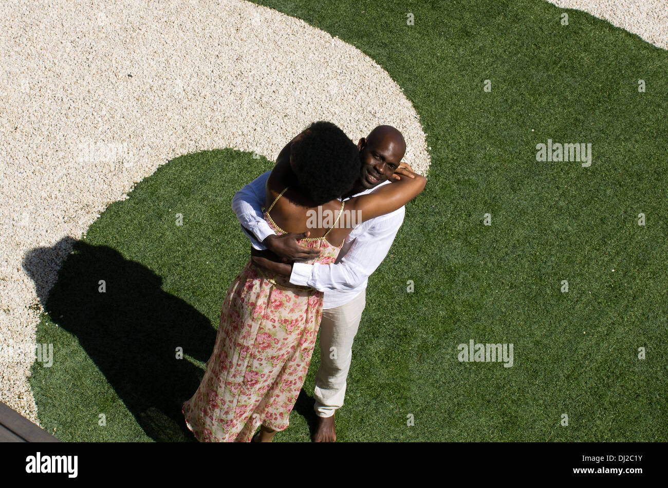 African American woman and her South African husband hugging happily on ...
