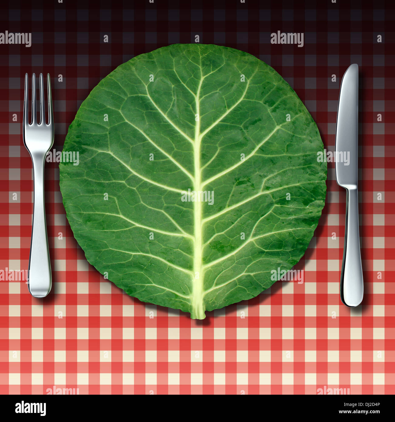 Vegetarian cuisine as a healthy lifestyle food concept with a fork and knife place setting as a green vegetable leaf shaped as a dinner plate on a checkered restaurant table cloth as a metaphor for market fresh nutritious cooking. Stock Photo
