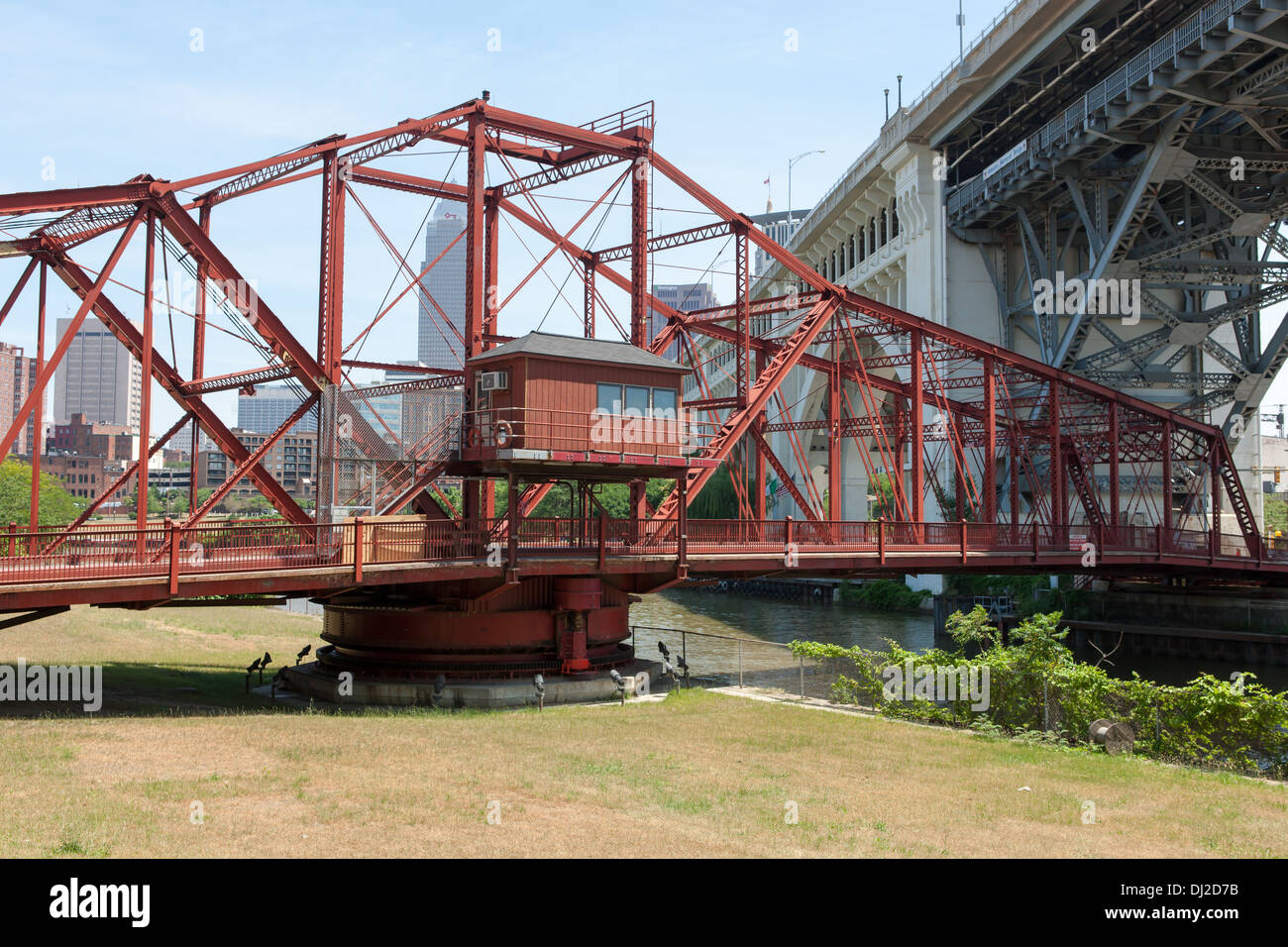 The Center Street Swing Bridge moves back into position after allowing a ship to pass on the Cuyahoga River in Cleveland, Ohio. Stock Photo