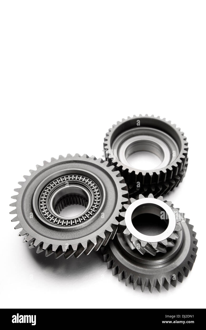 Metal cog gears joining together Stock Photo