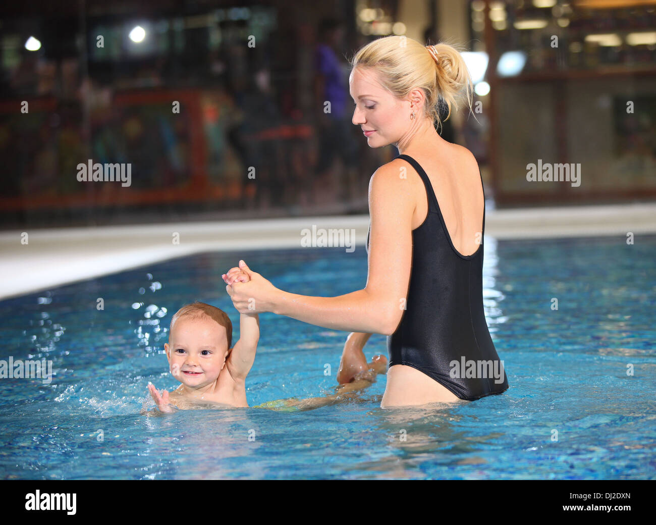 Young cheerful mother and little son in a swimming pool Stock Photo Alamy