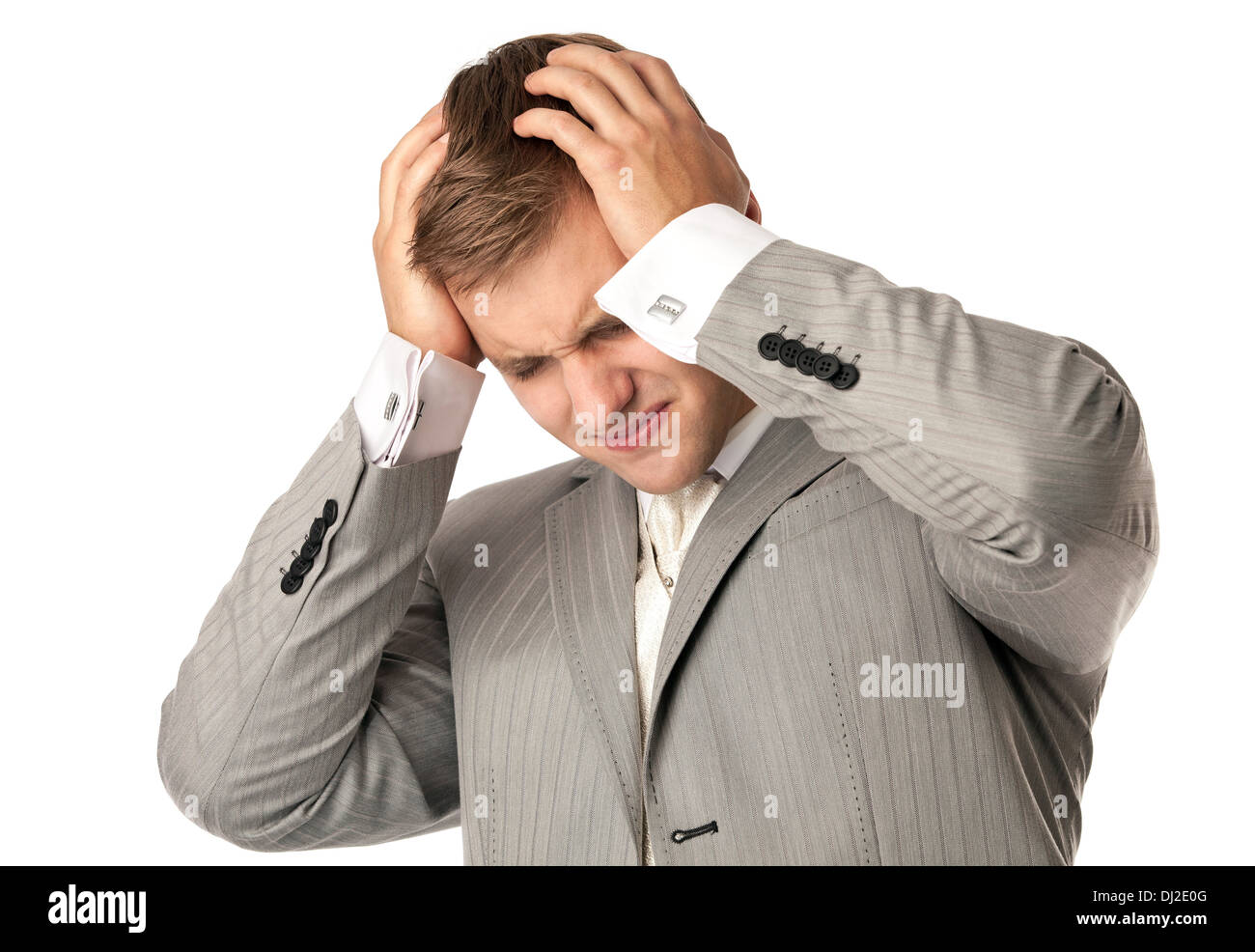 Young man in suit suffering from bad headache Stock Photo