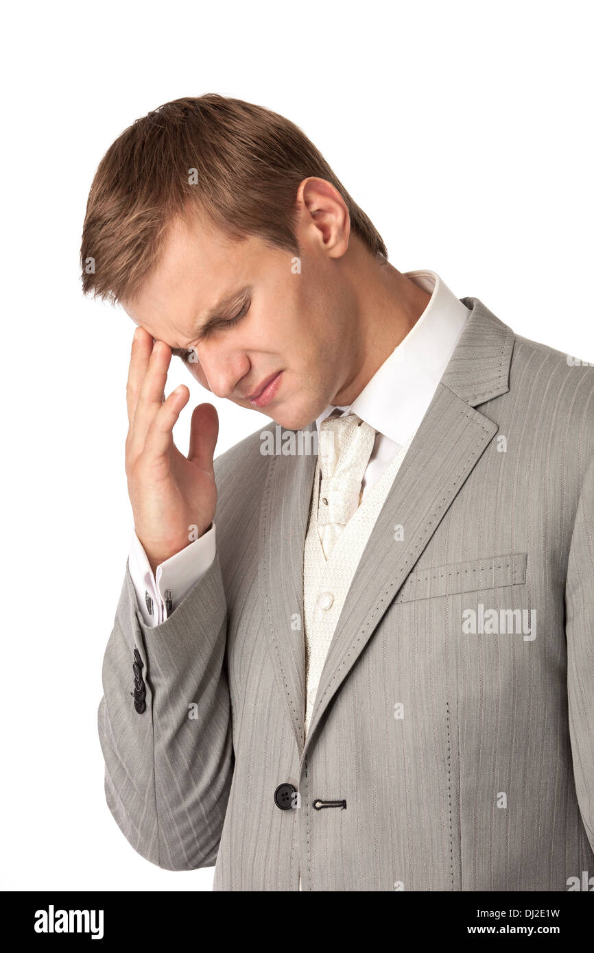 Young man in suit suffering from bad headache Stock Photo