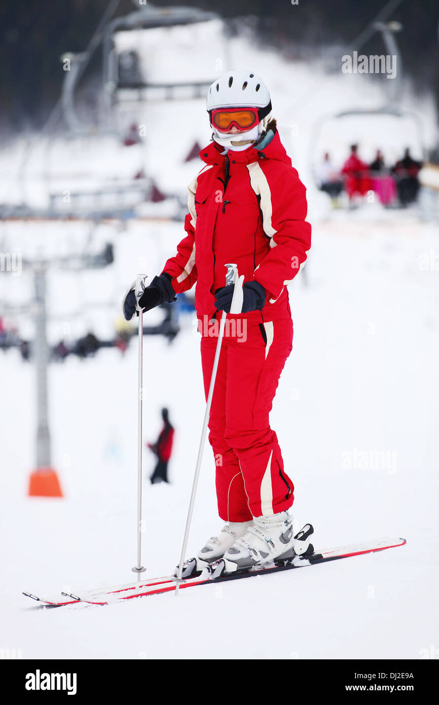 Female skier standing on mountain slope Stock Photo - Alamy