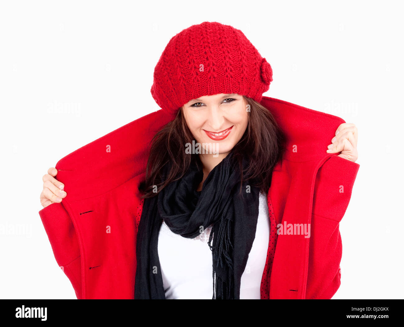 Young Woman in Red Coat and Cap Smiling - Isolated on White Stock Photo