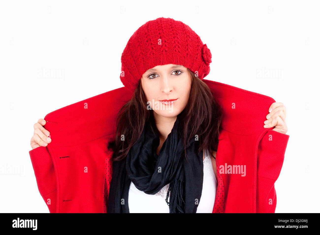 Young Woman in Red Coat and Cap - Isolated on White Stock Photo