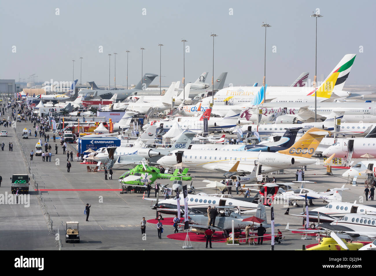 Many aircraft on apron at Al Maktoum International airport during Dubai Airshow 2013 in United Arab Emirates Stock Photo