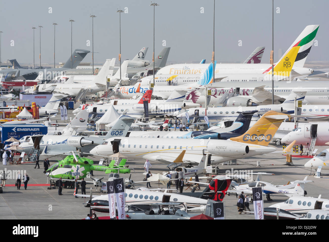 Many aircraft on apron at Al Maktoum International airport during Dubai Airshow 2013 in United Arab Emirates Stock Photo