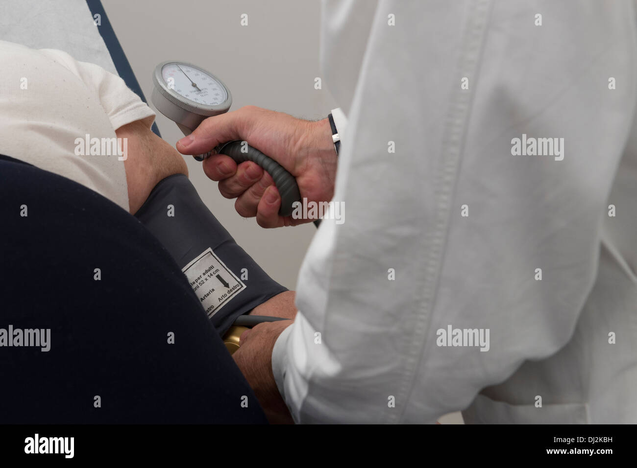 Medical doctor measuring bloody pressure Stock Photo
