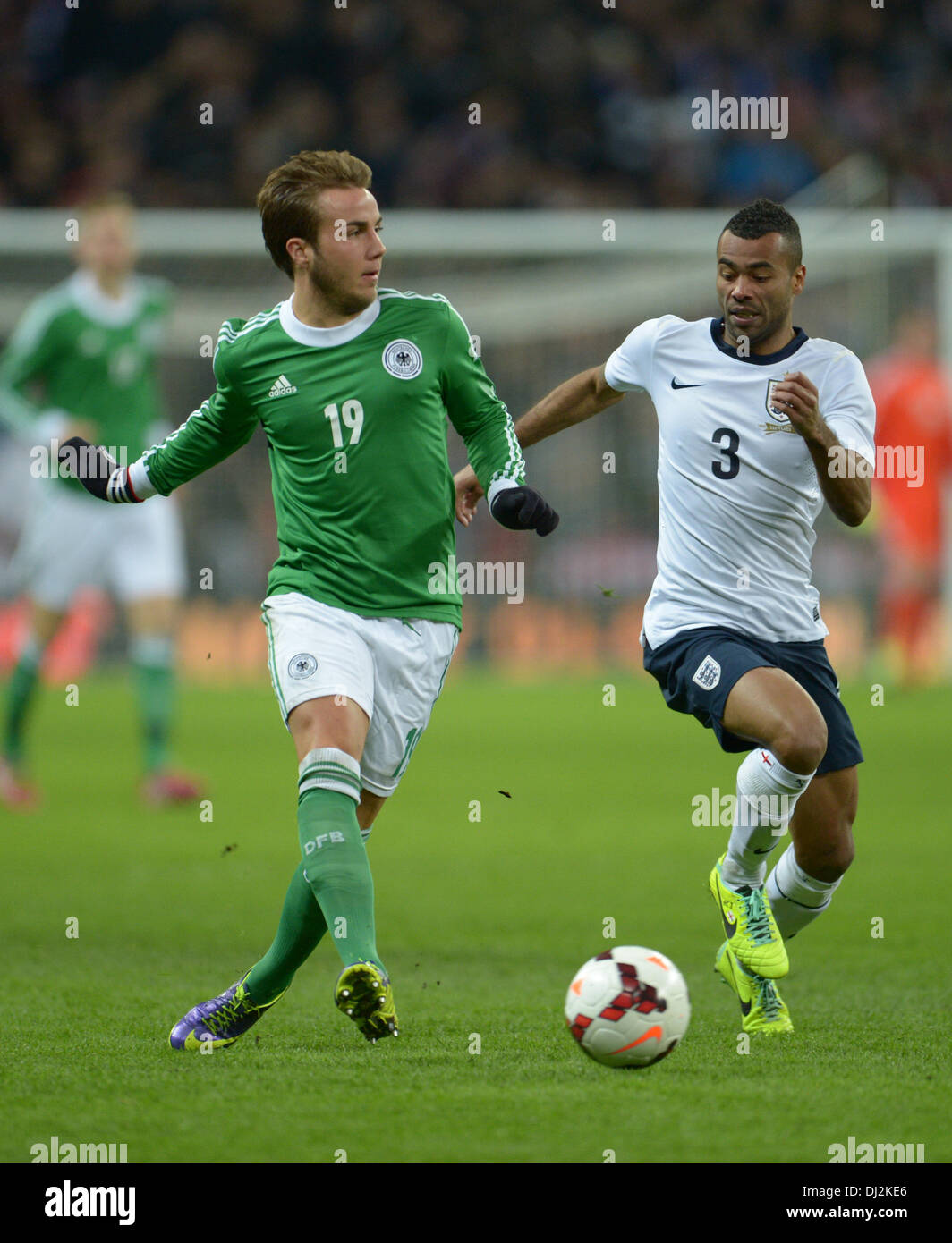London, UK. 19th Nov, 2013. England's Ashley Cole and Germany's Mario Goetze (L) vie for the ball during the friendly soccer match between England and Germany at Wembley Stadium in London, England, 19 November 2013. Photo: Andreas Gebert/dpa/Alamy Live News Stock Photo